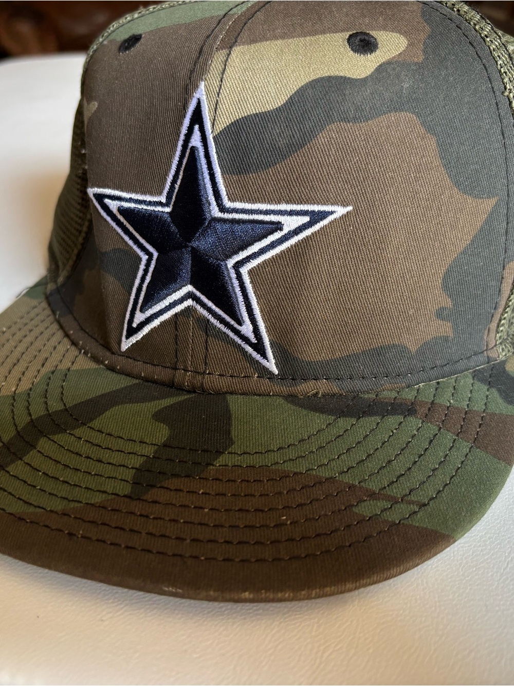 New Era Camo Trucker Hat with Black Star Patch